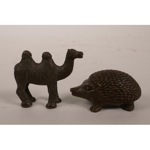 5 - A Chinese bronze figure of a hedgehog and another of a camel, 2