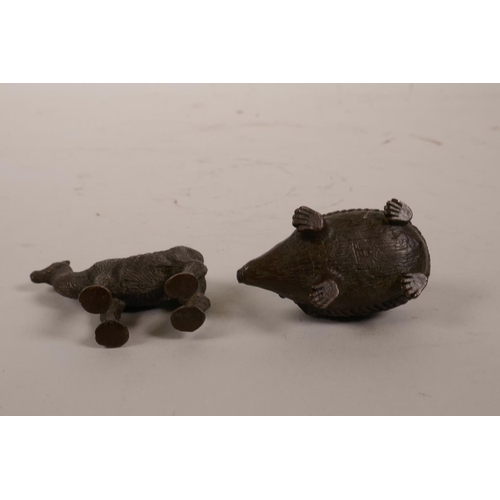 5 - A Chinese bronze figure of a hedgehog and another of a camel, 2