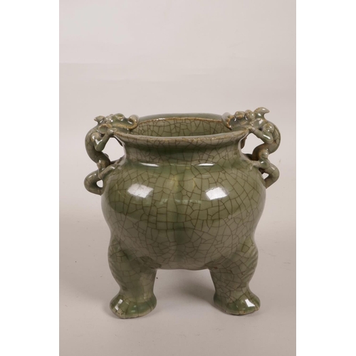 55 - A Chinese green crackle glazed porcelain censer on tripod feet with two dragon handles, 6