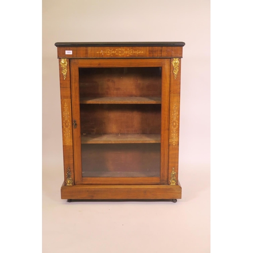 1189 - A C19th inlaid walnut pier cabinet with single glazed door and ormolu mounts on plinth base and cast... 