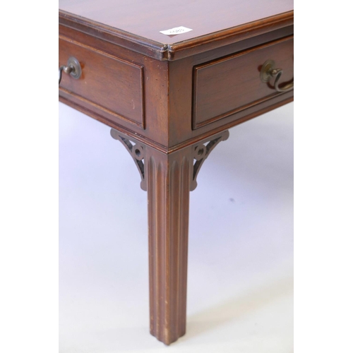 1197 - A mahogany square top coffee table with two true and six dummy frieze drawers, on fluted square sect... 