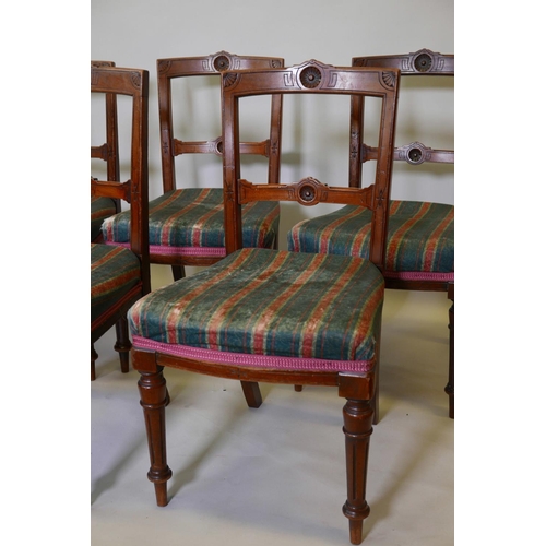 1187 - A set of six late Victorian dining chairs with aesthetic style decoration