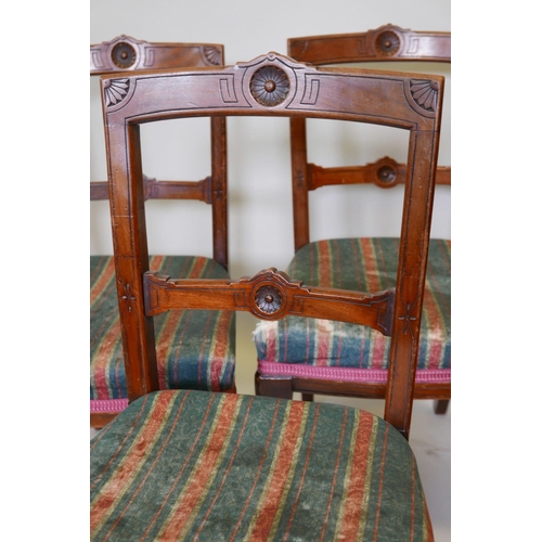 1187 - A set of six late Victorian dining chairs with aesthetic style decoration