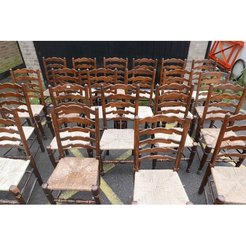 1206 - A long set of ten ash ladderback chairs with rush and seagrass seats, early C20th