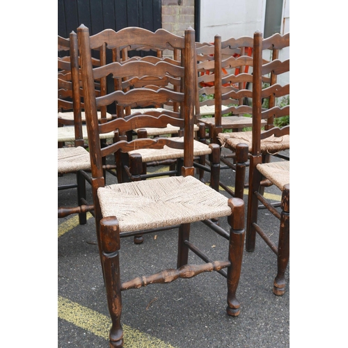 1206 - A long set of ten ash ladderback chairs with rush and seagrass seats, early C20th