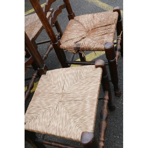 1206 - A long set of ten ash ladderback chairs with rush and seagrass seats, early C20th