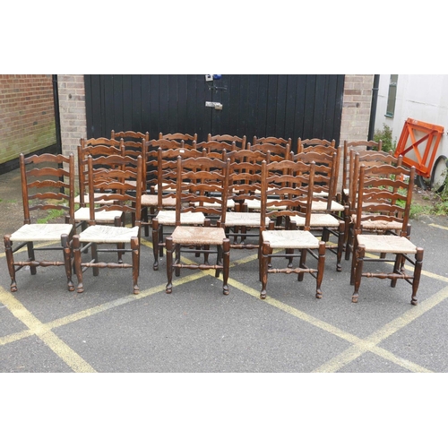 1206 - A long set of ten ash ladderback chairs with rush and seagrass seats, early C20th