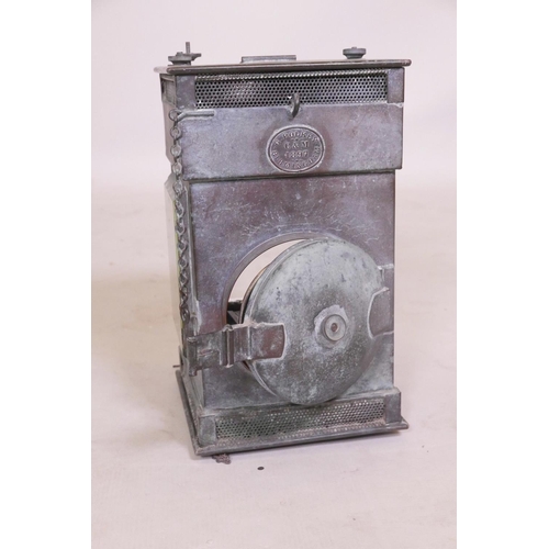 1 - A C19th copper railway lantern, with three bevelled glass windows and copper reflector, stamped G. P... 