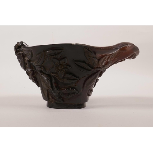 18 - A Chinese sectional horn libation cup with carved floral decoration, incised mark to base, 6