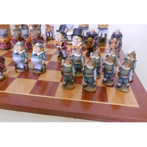 27 - An Alice Through the Looking Glass chess set, the hand painted models of cold cast marble, manufactu... 