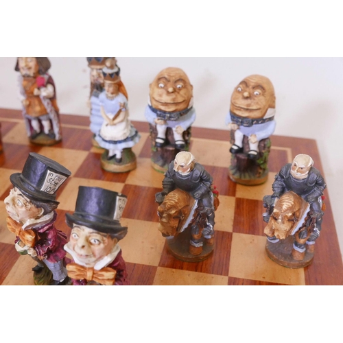 27 - An Alice Through the Looking Glass chess set, the hand painted models of cold cast marble, manufactu... 