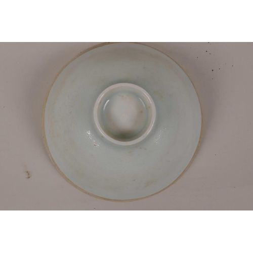 35 - A Chinese duck egg blue glazed Song style bowl with raised phoenix and floral decoration, 4½