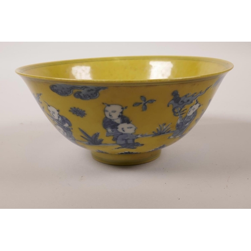 45 - A Chinese yellow ground porcelain bowl with blue and white decoration of boys playing in a garden, 6... 