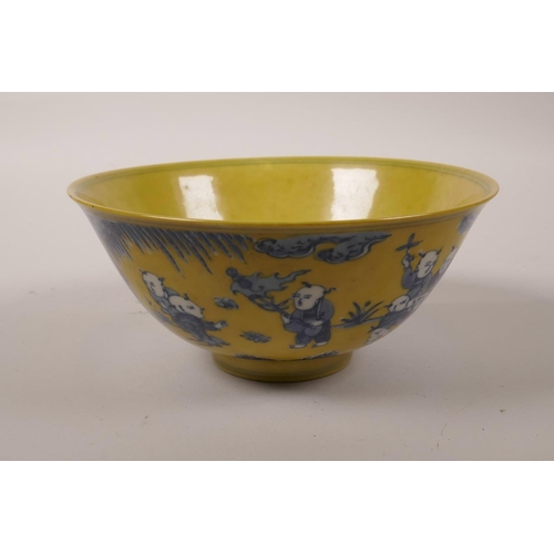 45 - A Chinese yellow ground porcelain bowl with blue and white decoration of boys playing in a garden, 6... 