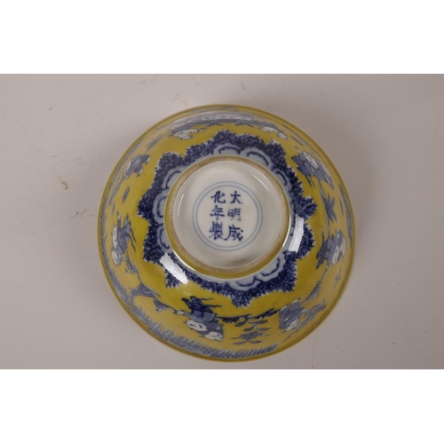 45 - A Chinese yellow ground porcelain bowl with blue and white decoration of boys playing in a garden, 6... 