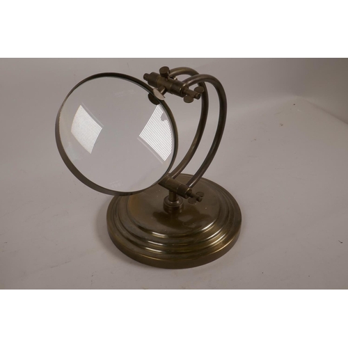 47 - A brass adjustable table magnifying glass, lens 5