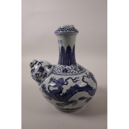 51 - A Chinese blue and white porcelain hookah base decorated with a phoenix and dragon in flight, 4 char... 