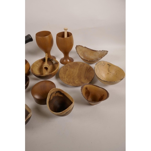 57 - A collection of treen bowls, dishes and jars, and a table cannon