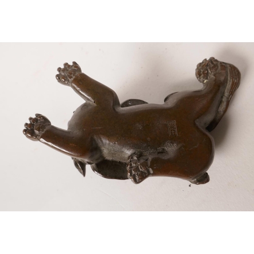 58 - A small Chinese bronze of a mythical creature, impressed mark to base, 3