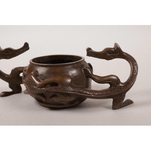 60 - A Chinese coppered bronze censer with two handles in the form of dragons, 2½