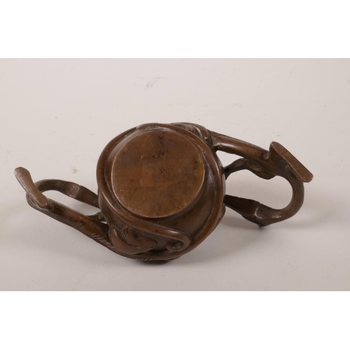 60 - A Chinese coppered bronze censer with two handles in the form of dragons, 2½