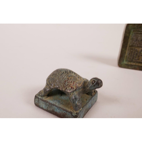 13 - A Chinese bronze seal with dragon decoration, and another smaller with tortoise decoration, 1½