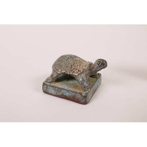 13 - A Chinese bronze seal with dragon decoration, and another smaller with tortoise decoration, 1½