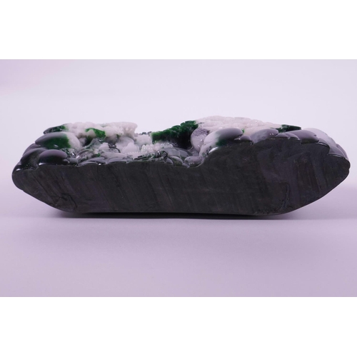 33 - A moulded reconstituted jade ornament depicting a mountainous landscape with temples, 8½