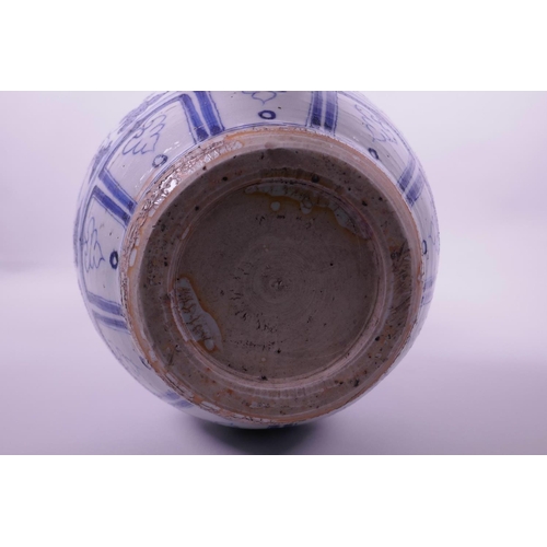 38 - A Chinese blue and white pottery double gourd vase decorated with lotus flowers and kylin, 13½