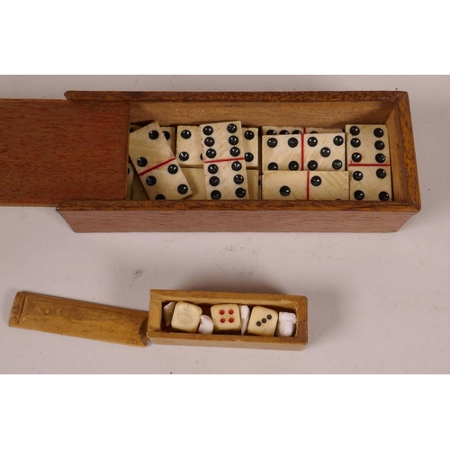 39 - A small mahogany box of miniature bone dominoes, 3¼