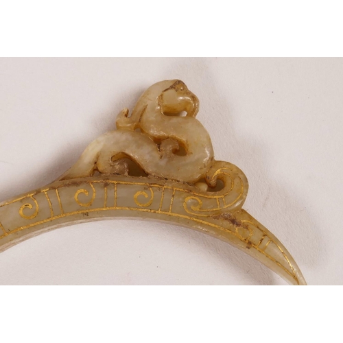 45 - A Chinese carved grey jade pendant with gilt inlay and dragon head decoration, 4