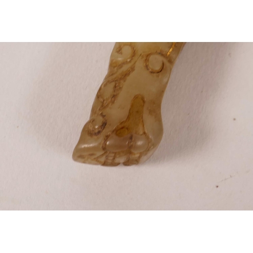 45 - A Chinese carved grey jade pendant with gilt inlay and dragon head decoration, 4