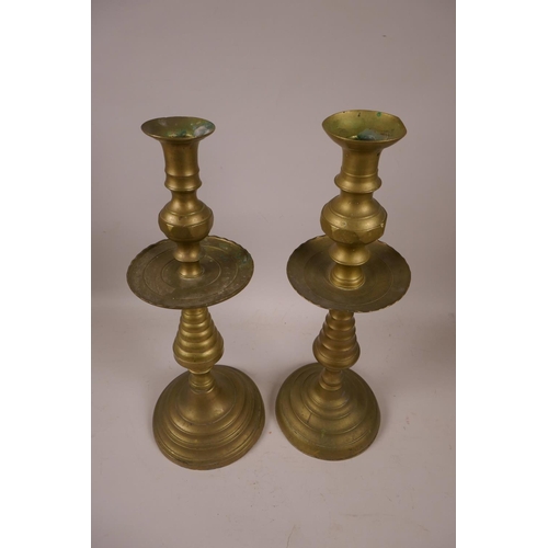 47 - A near pair of brass candlesticks, 14½