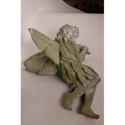 51 - A cast metal garden figurine of a sleeping fairy, 16½