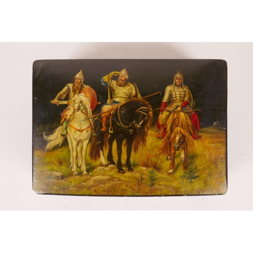 54 - A Russian black lacquer trinket box with hand painted decoration of three C16th cavalrymen, signed i... 