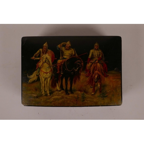 54 - A Russian black lacquer trinket box with hand painted decoration of three C16th cavalrymen, signed i... 