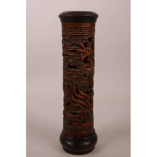 8 - A Chinese bamboo and hardwood cylinder incense burner with carved and pierced dragon decoration, 10