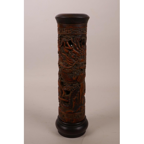 8 - A Chinese bamboo and hardwood cylinder incense burner with carved and pierced dragon decoration, 10