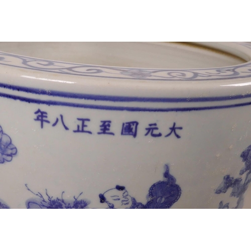 16 - A large Chinese blue and white porcelain jardiniere decorated with figures in a landscape, 7 charact... 