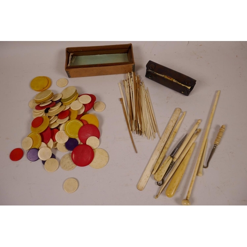 34 - A quantity of Chinese dyed bone gaming chips together with a box of bone and wood gaming sticks, a l... 