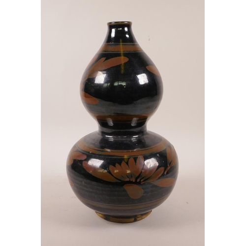 45 - A Chinese Cizhou kiln double gourd vase with floral decoration, 10½