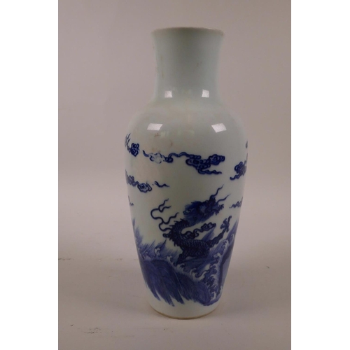 48 - A Chinese blue and white porcelain vase decorated with dragons above a stormy sea, 6 character mark ... 