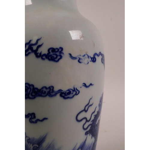 48 - A Chinese blue and white porcelain vase decorated with dragons above a stormy sea, 6 character mark ... 