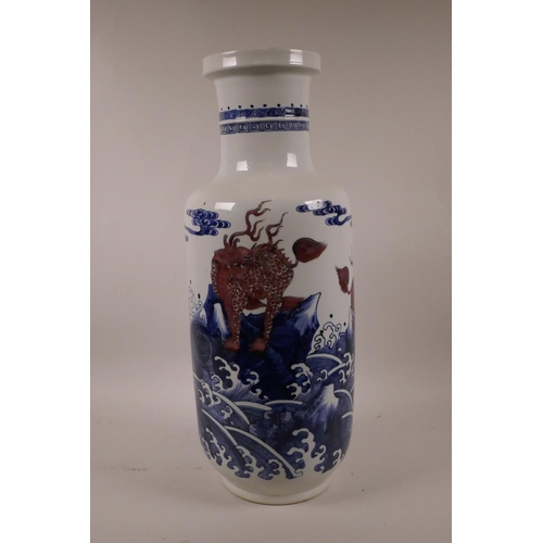 5 - A Chinese blue and white porcelain Rouleau vase decorated with mythical creatures in red, 17½