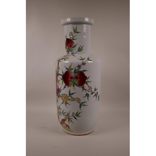 55 - A Chinese polychrome Rouleau vase with enamel decoration of a fruit laden peach tree, 17½