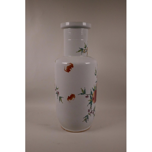 55 - A Chinese polychrome Rouleau vase with enamel decoration of a fruit laden peach tree, 17½