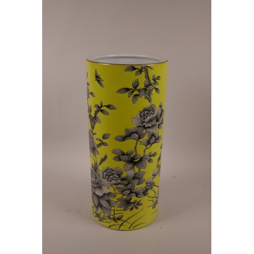 8 - A Chinese yellow ground porcelain cylinder vase with black and white floral decoration, character ma... 