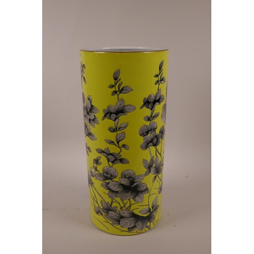 8 - A Chinese yellow ground porcelain cylinder vase with black and white floral decoration, character ma... 