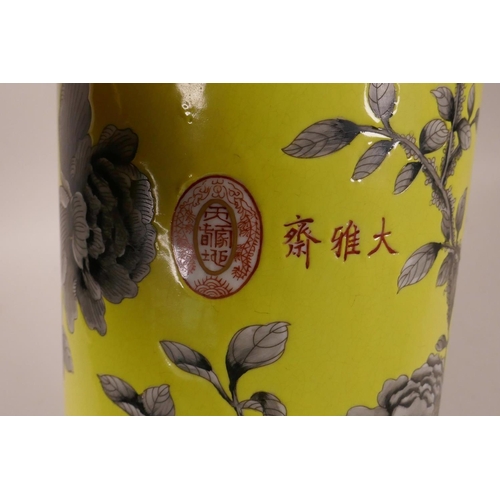 8 - A Chinese yellow ground porcelain cylinder vase with black and white floral decoration, character ma... 