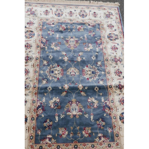 1132 - A Kashmiri duck egg blue rug decorated with a Ziegler design to centre and cream ground border, 51